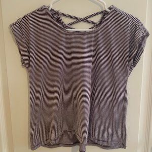 A navy and white striped casual girls shirt.